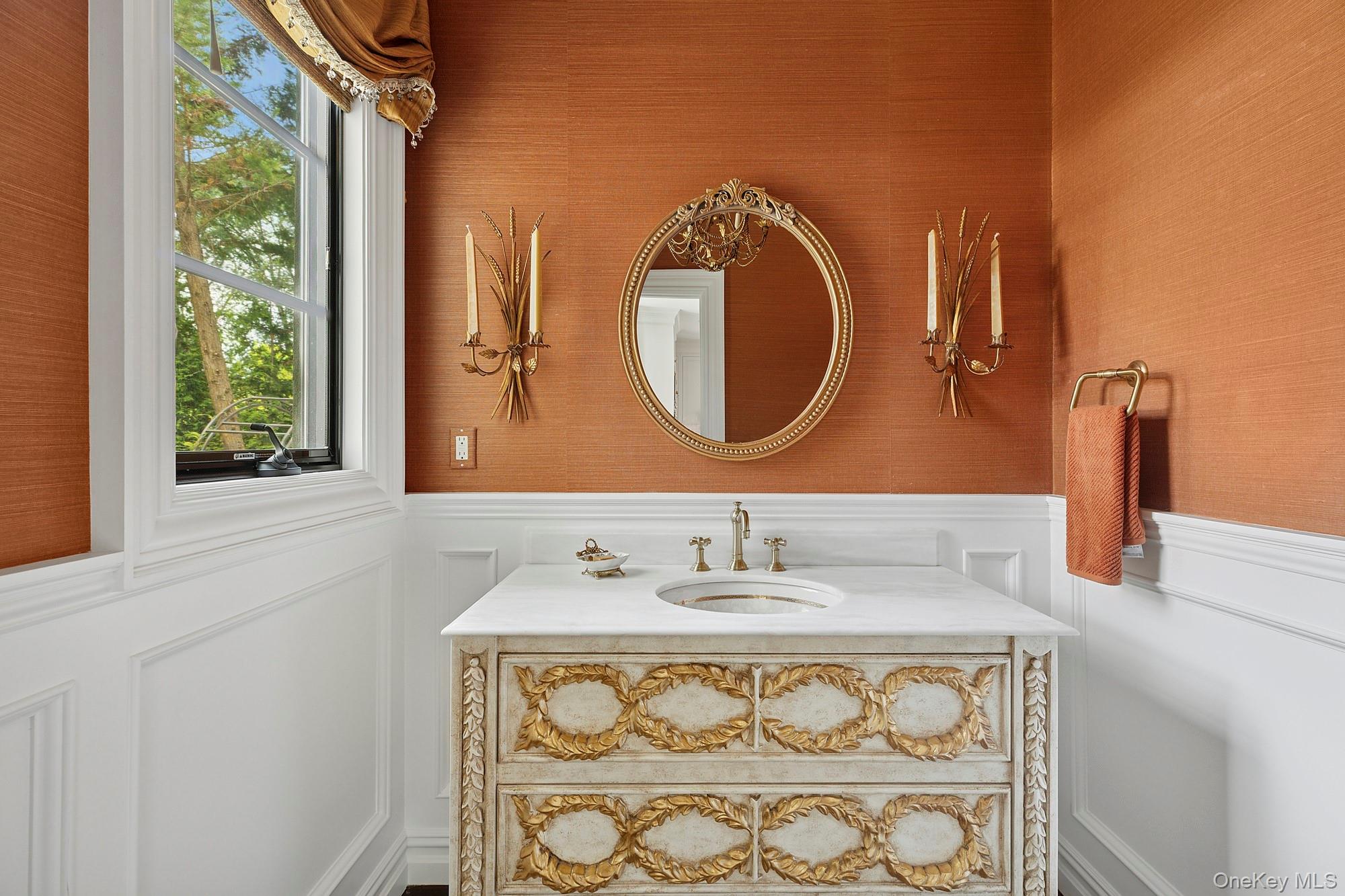 353 Centre Island Road Oyster Bay, NY 11771 - Photo 20 of 34 a bathroom with a sink and a mirror