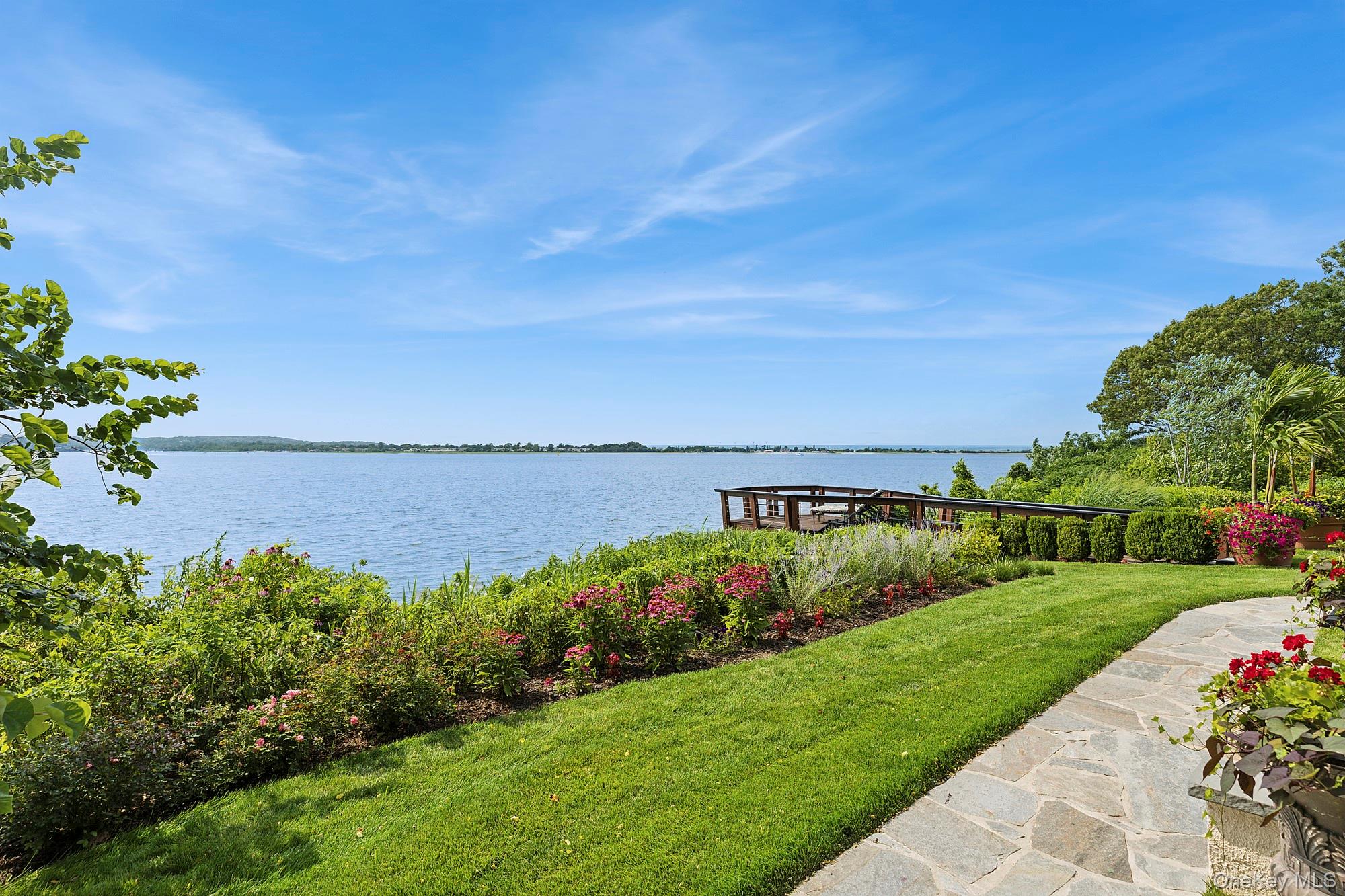 353 Centre Island Road Oyster Bay, NY 11771 - Photo 24 of 34 a view of a garden with a building in the background