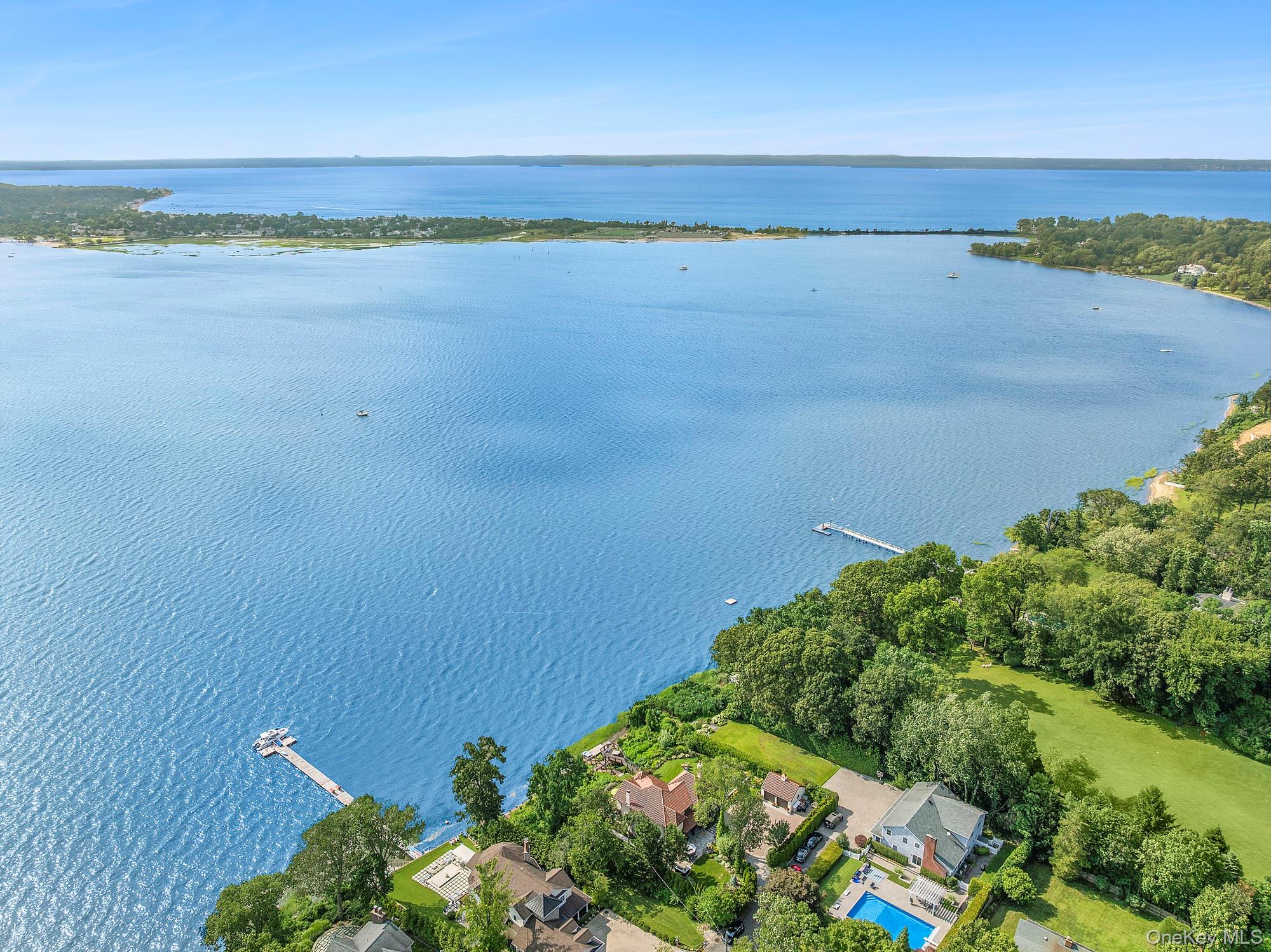 353 Centre Island Road Oyster Bay, NY 11771 - Photo 32 of 34 a view of a lake with a beach
