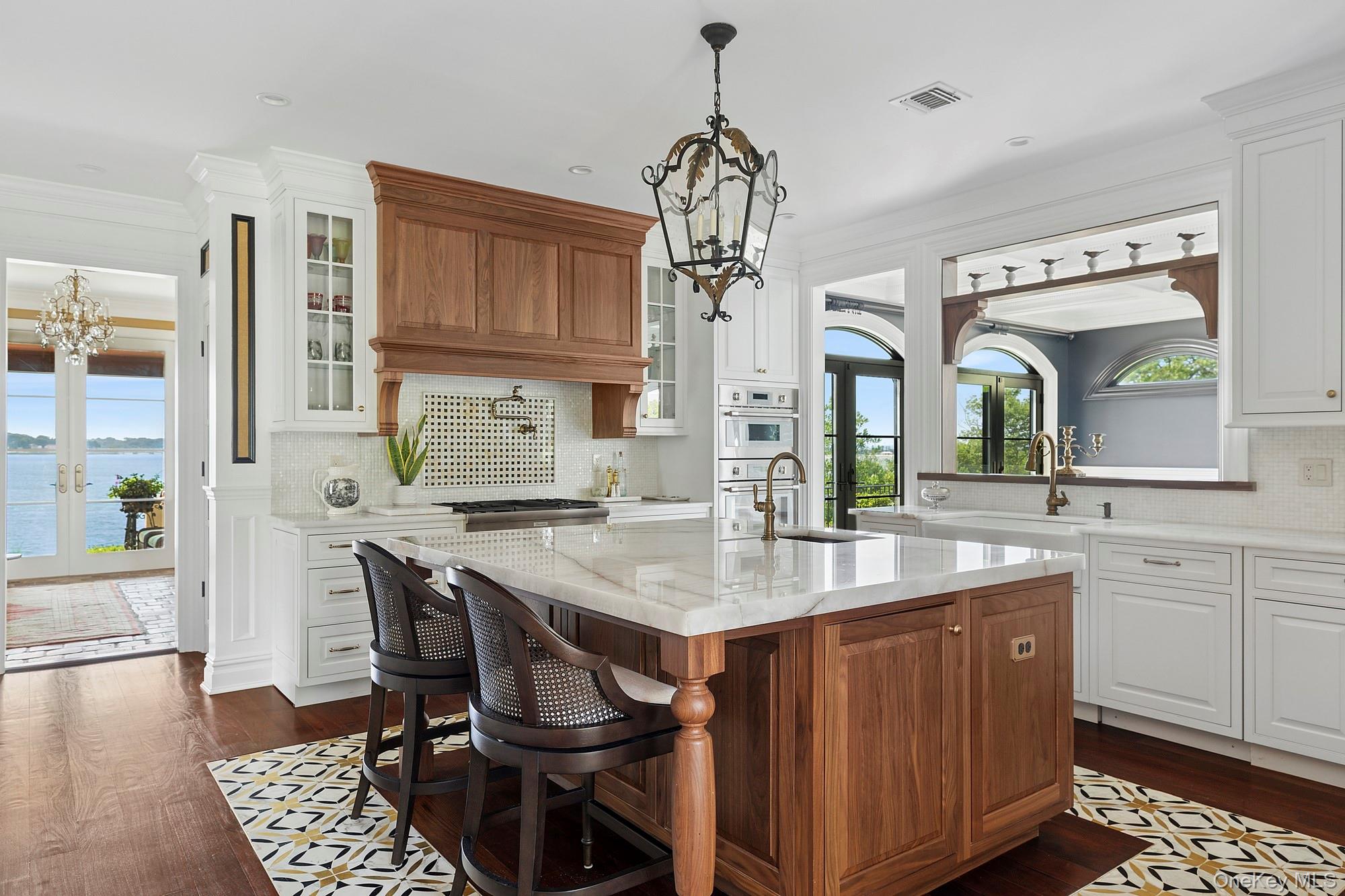 353 Centre Island Road Oyster Bay, NY 11771 - Photo 4 of 34 a view of kitchen island dining area kitchen island and stainless steel appliances
