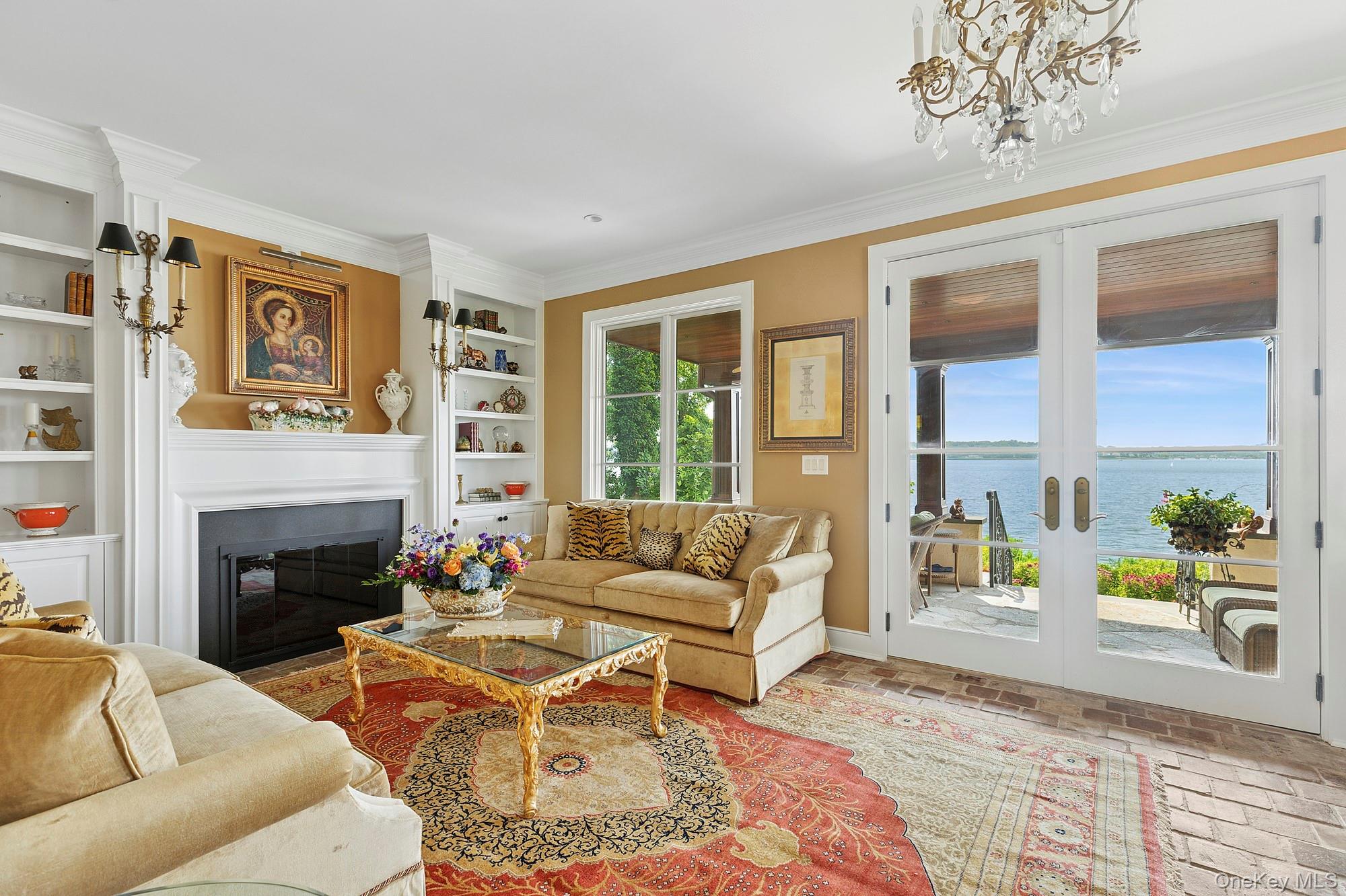 353 Centre Island Road Oyster Bay, NY 11771 - Photo 8 of 34 a living room with furniture and a fireplace
