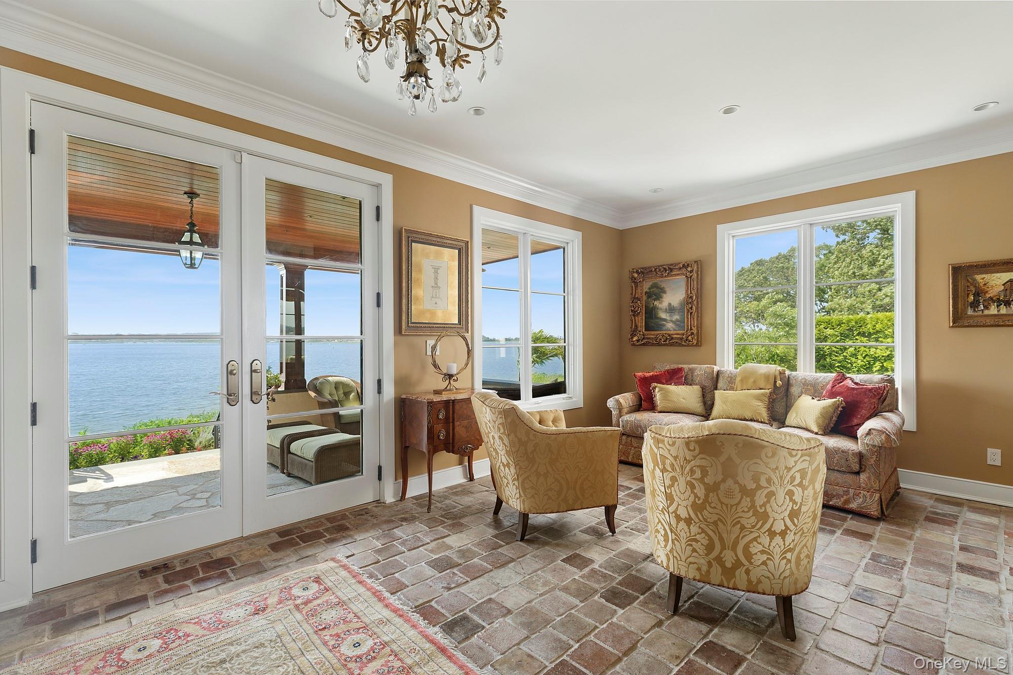 353 Centre Island Road Oyster Bay, NY 11771 - Photo 9 of 34 a living room with furniture and a floor to ceiling window