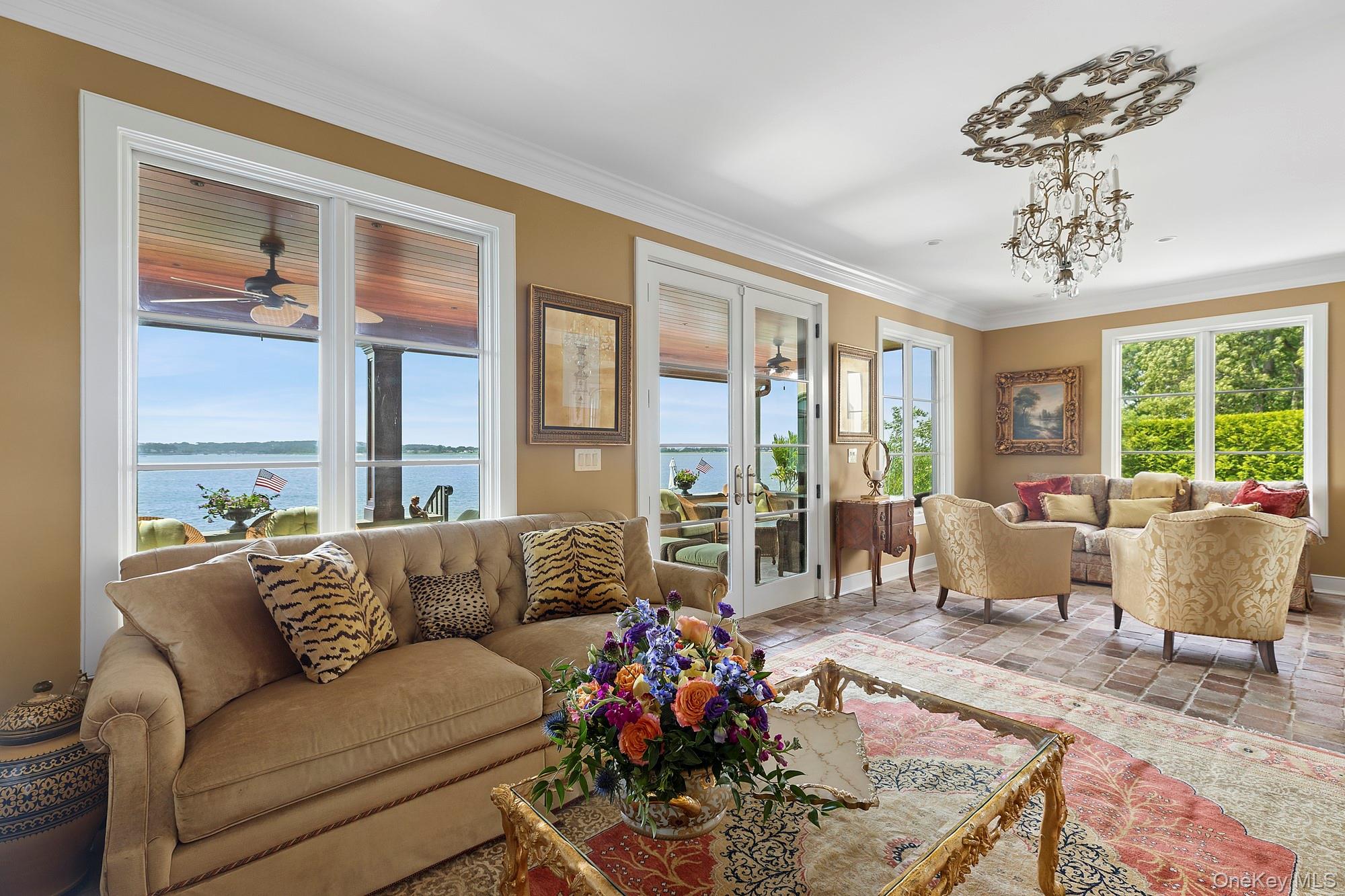 353 Centre Island Road Oyster Bay, NY 11771 - Photo 10 of 34 a living room with furniture and floor to ceiling windows