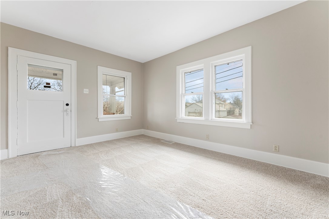 150 Diagonal Street Rittman, OH 44270 - Photo 10 of 21 Foyer entrance with light carpet, tons of natural light!