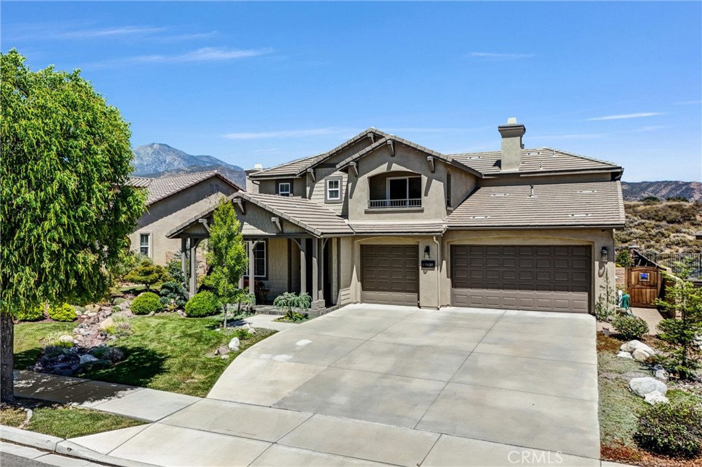 11659 Bluegrass Road Yucaipa, CA 92399 - Photo 1 of 1 a front view of a house with yard