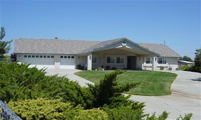 7510 Rodeo Road Hesperia, CA 92344 - Photo 1 of 1 a front view of a house with a yard