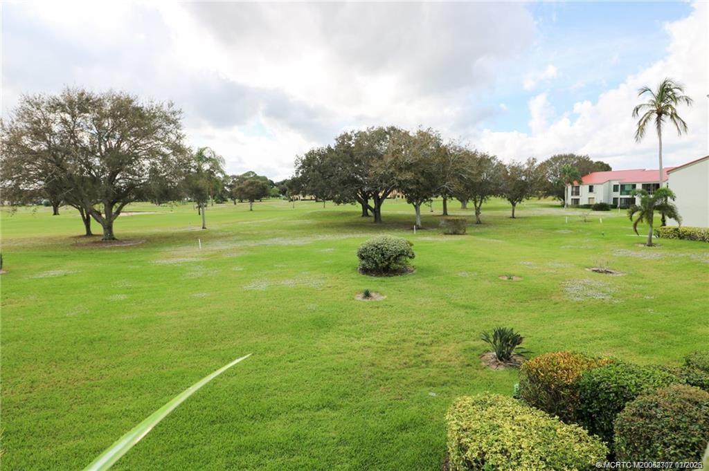 5433 Southeast Miles Grant Road, Unit 203 Stuart, FL 34997 - Photo 14 of 15 a view of an outdoor space and yard