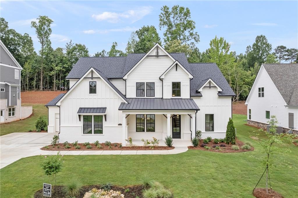 4505 Ryker Road Cumming, GA 30041 - Photo 1 of 1 a front view of a house with a yard