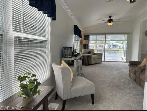 398 Leopard Lane, Unit 398 Naples, FL 34114 - Photo 14 of 50 a living room with furniture and a window