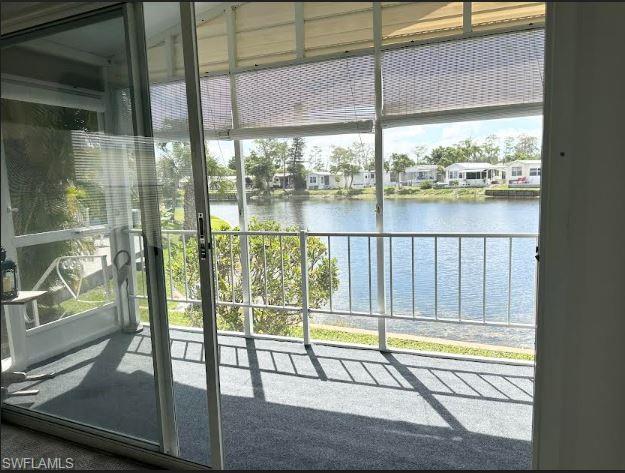 398 Leopard Lane, Unit 398 Naples, FL 34114 - Photo 18 of 50 a view of swimming pool from a window