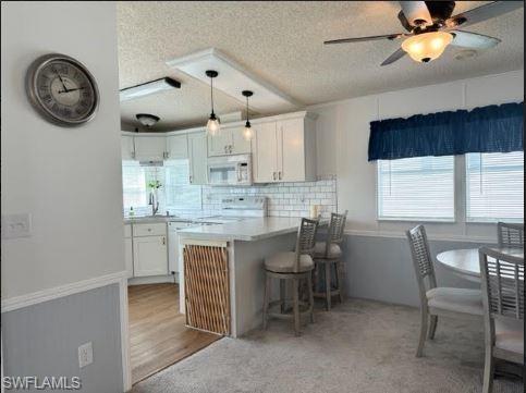398 Leopard Lane, Unit 398 Naples, FL 34114 - Photo 22 of 50 a view of kitchen with breakfast area
