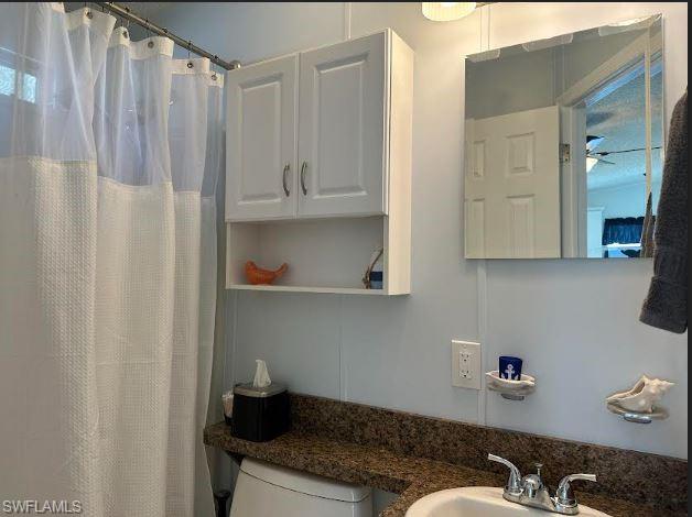 398 Leopard Lane, Unit 398 Naples, FL 34114 - Photo 28 of 50 a room with a walk in closet and a mirror