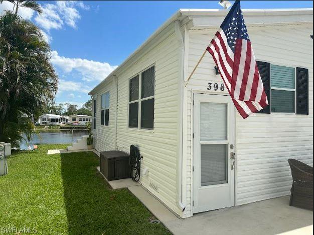 398 Leopard Lane, Unit 398 Naples, FL 34114 - Photo 3 of 50 a view of a house with backyard and sitting area