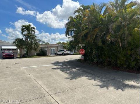 398 Leopard Lane, Unit 398 Naples, FL 34114 - Photo 41 of 50 a view of street with parked cars