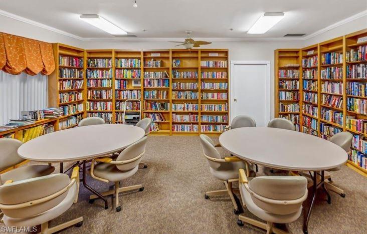 398 Leopard Lane, Unit 398 Naples, FL 34114 - Photo 47 of 50 a table and chairs in a room