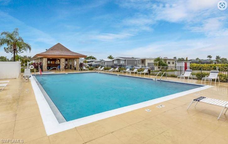 398 Leopard Lane, Unit 398 Naples, FL 34114 - Photo 50 of 50 a view of a swimming pool and a terrace