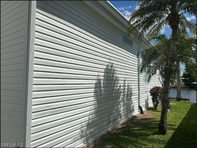 398 Leopard Lane, Unit 398 Naples, FL 34114 - Photo 6 of 50 a view of backyard of a house