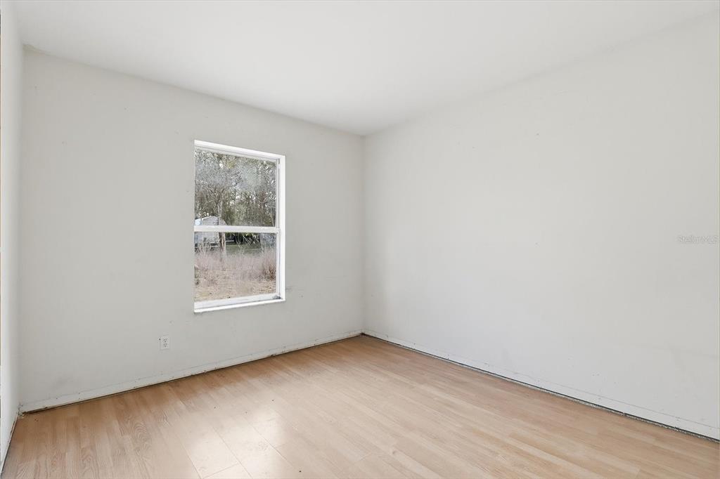 5120 East Hopp Lane Inverness, FL 34452 - Photo 18 of 26 an empty room with a window