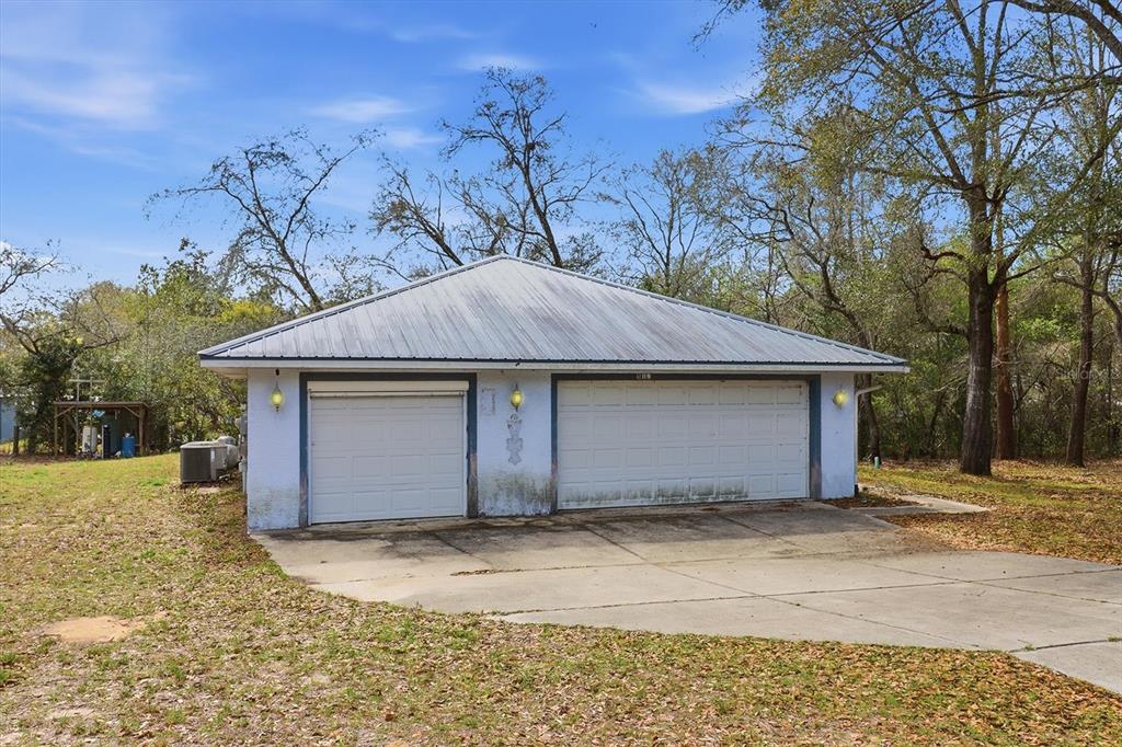 5120 East Hopp Lane Inverness, FL 34452 - Photo 3 of 26 a house with trees in front of it