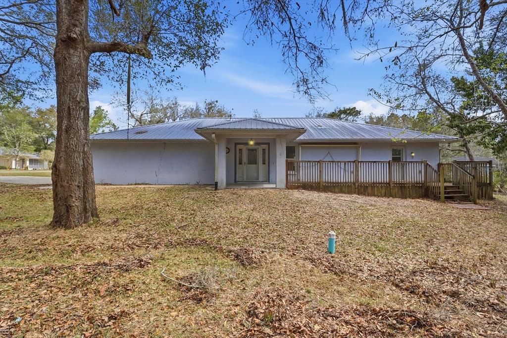 5120 East Hopp Lane Inverness, FL 34452 - Photo 5 of 26 a front view of a house with a yard