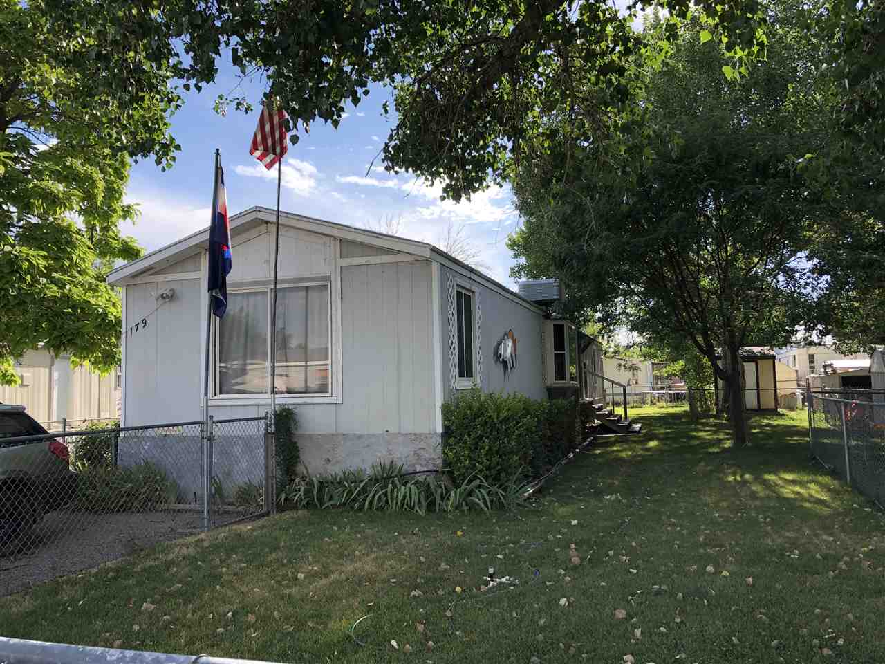 424 32 Road, Unit 179 Clifton, CO 81520 - Photo 1 of 7 a view of a house with a yard