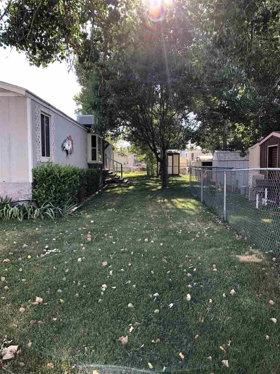 424 32 Road, Unit 179 Clifton, CO 81520 - Photo 2 of 7 a view of a house with a yard