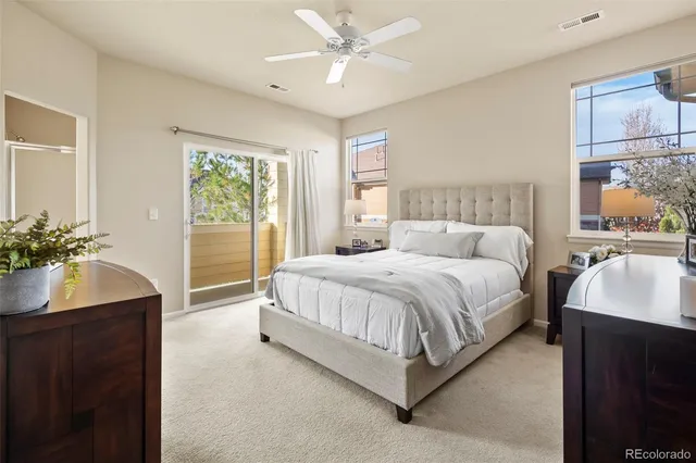 a bed room with a bed and a potted plant
