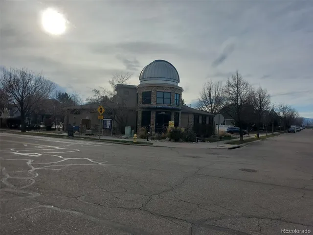 a view of a patio with a table and chairs