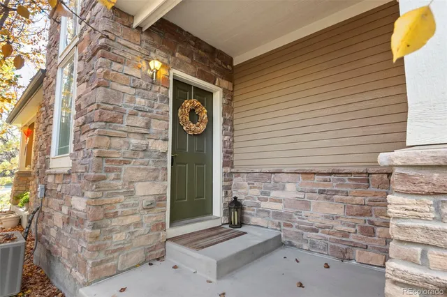 a brick building with a window and a sink