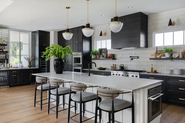 a view of a house with a big yard and a large tree