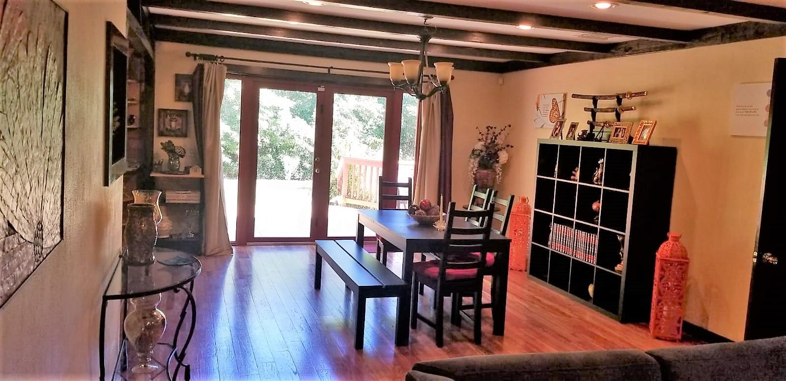 14930 Whatley Road Delray Beach, FL 33445 - Photo 9 of 26 a view of a dining room with furniture and a book shelf