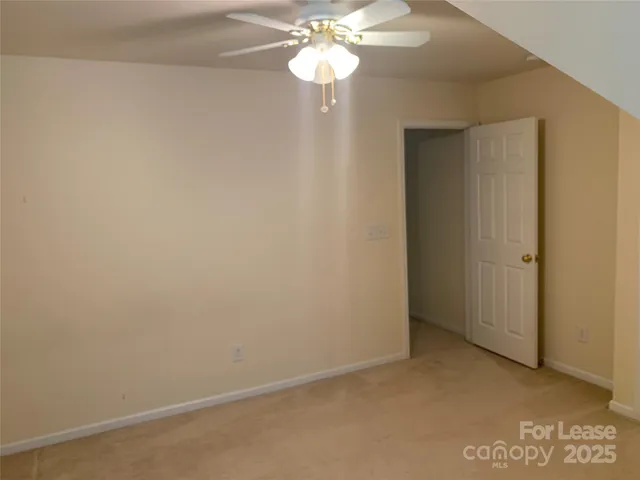 a view of a chandelier fan in a room