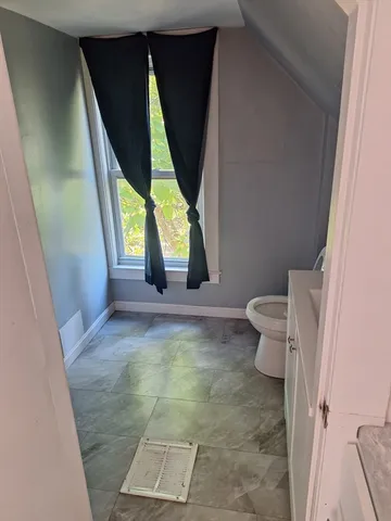 an empty room with a bench