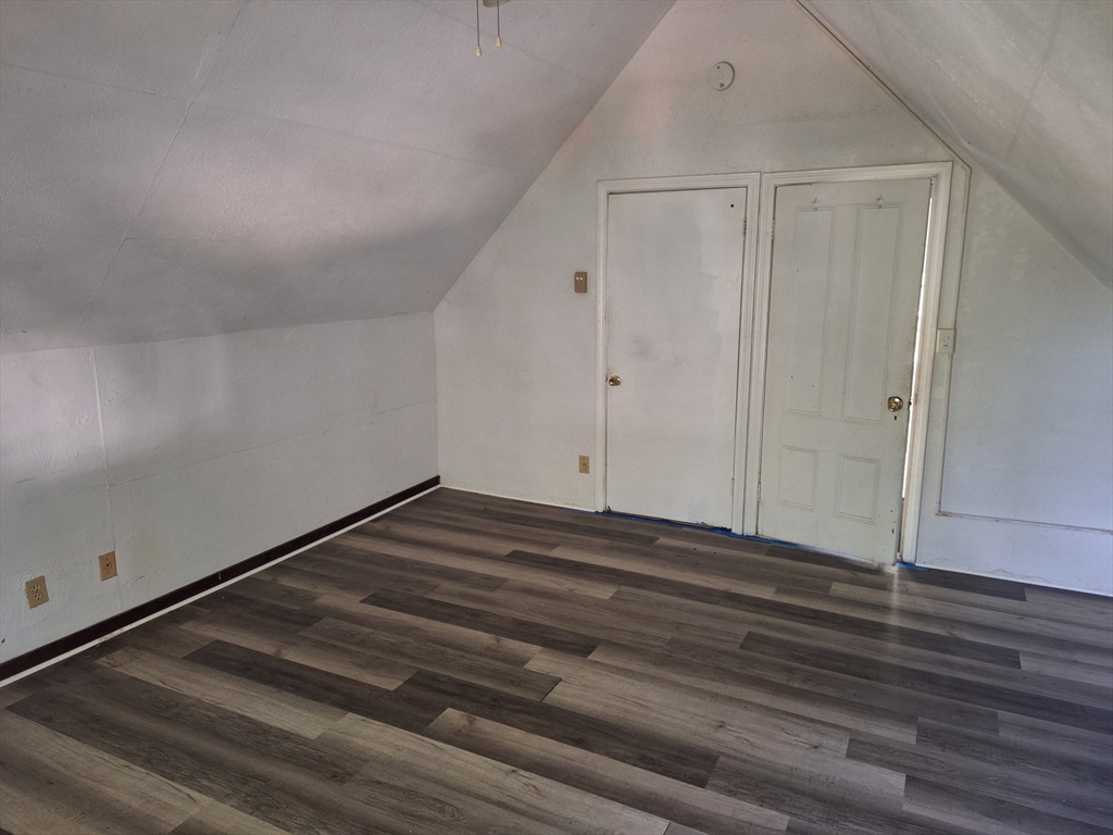 85 Lower E Street, Unit 2 Dedham, MA 02026 - Photo 5 of 13 a view of room with wooden floor