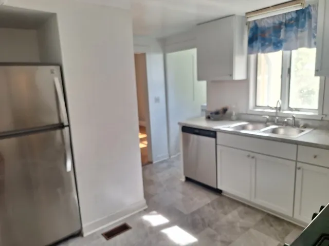 a utility room with window dryer and washer