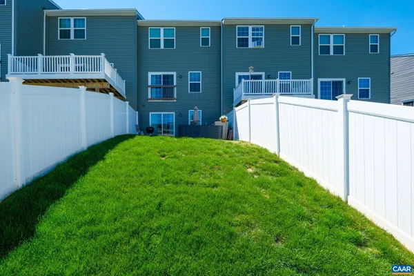 a backyard of a house with seating space