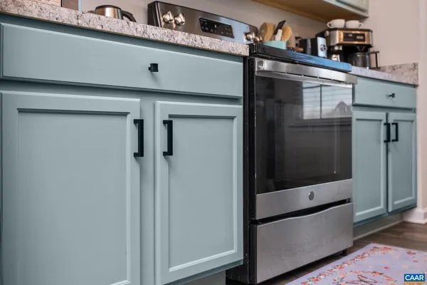a refrigerator freezer sitting inside of a kitchen