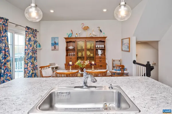 a kitchen with a sink and a refrigerator