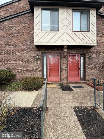a view of a house with large windows