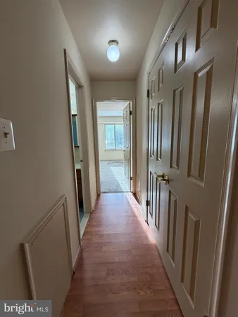 a view of a hallway with windows