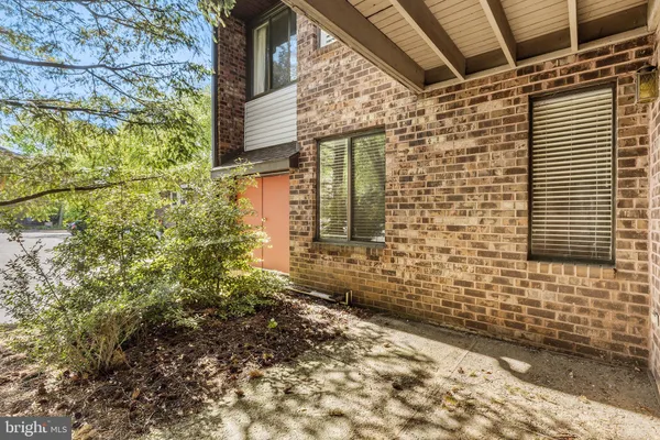 a brick building with a yard