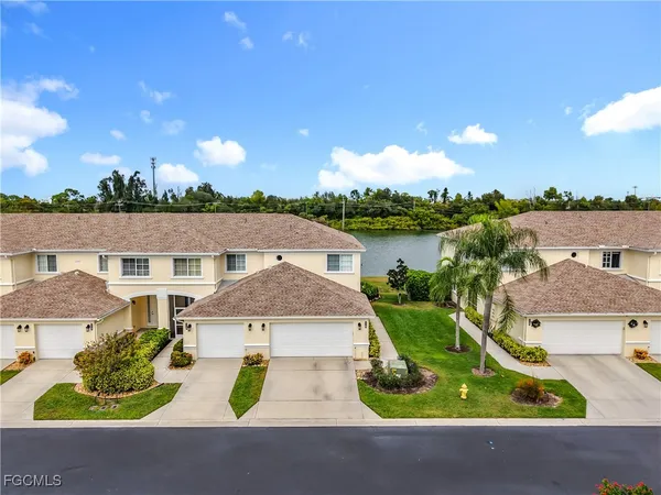 an aerial view of a house with garden space and street view