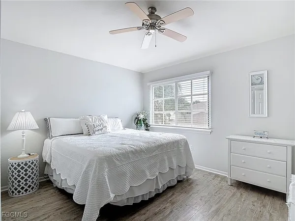 a bathroom with a toilet sink vanity and mirror