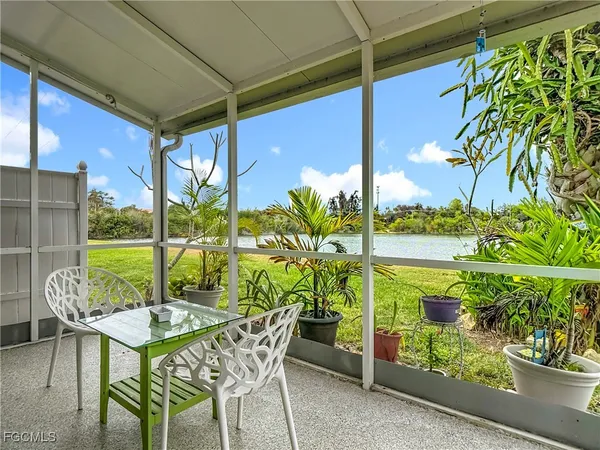 a view of an chairs and table in the patio