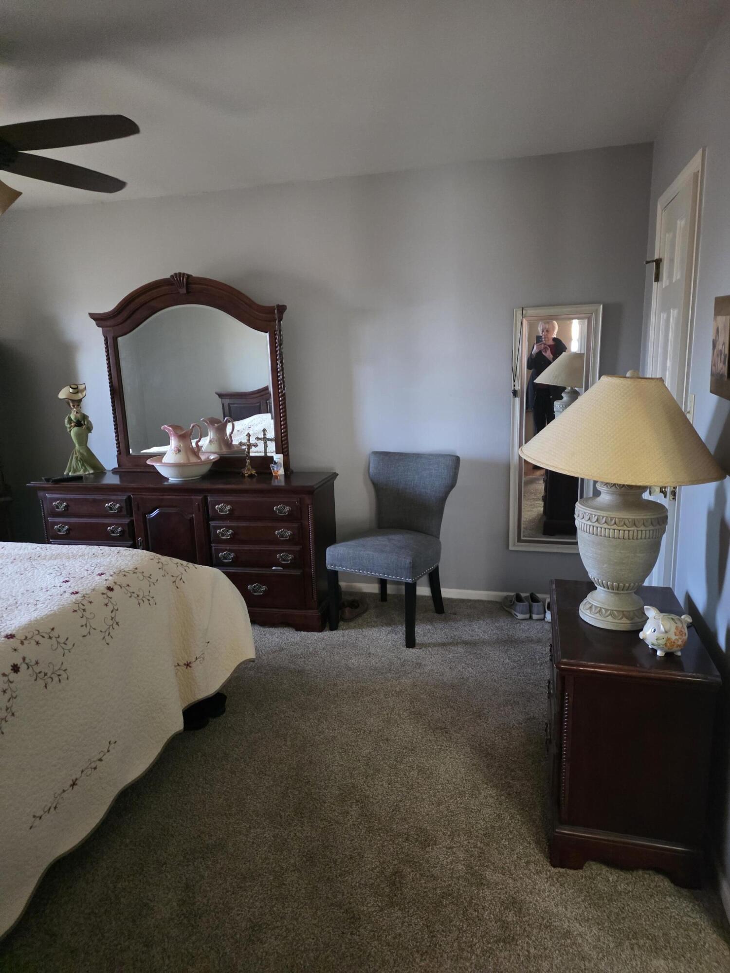 516 Begonia Street Southeast, Unit A De Motte, IN 46310 - Photo 18 of 25 a bedroom with a bed and a mirror