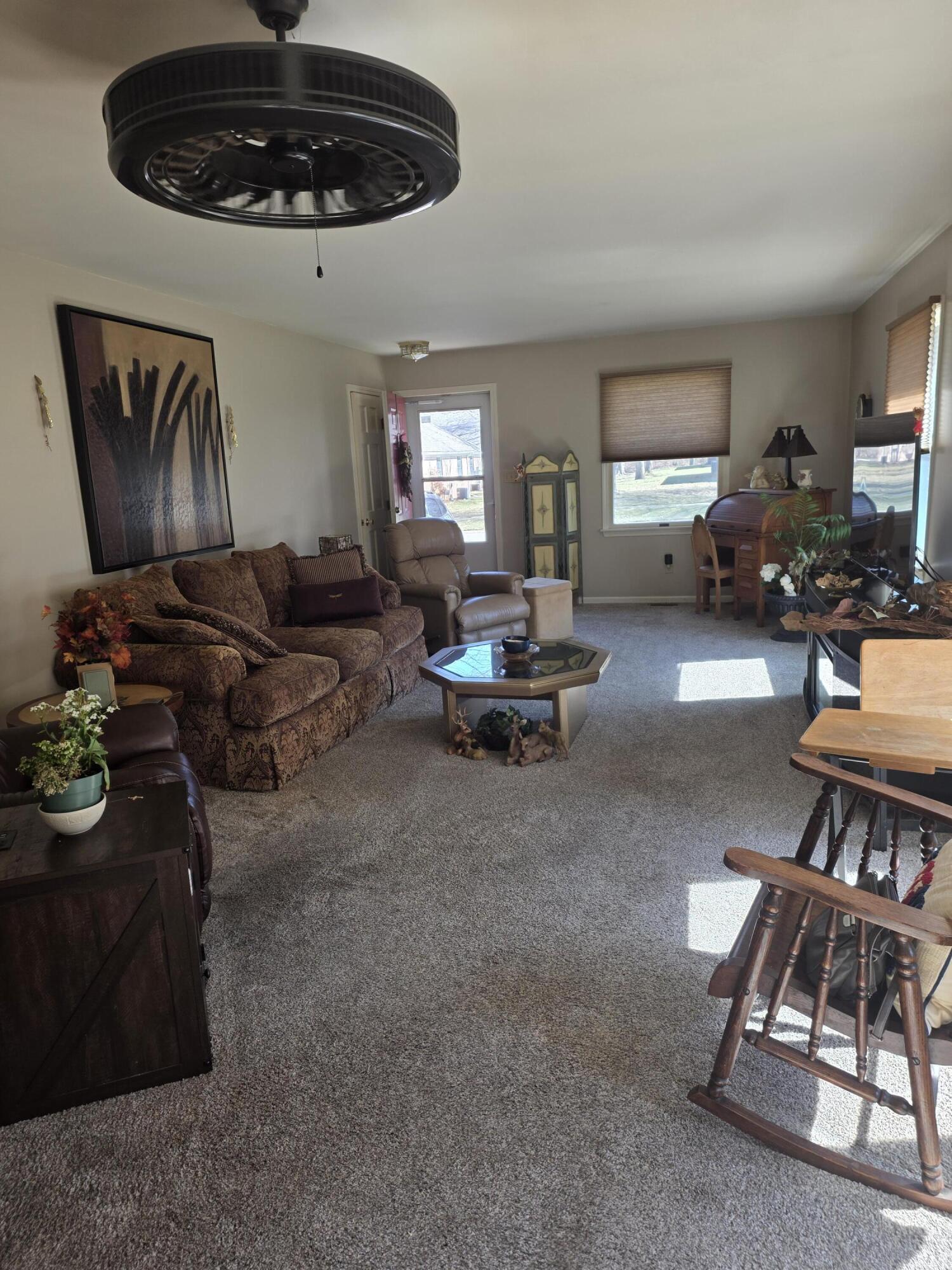 516 Begonia Street Southeast, Unit A De Motte, IN 46310 - Photo 6 of 25 a living room with furniture flowerpot and window