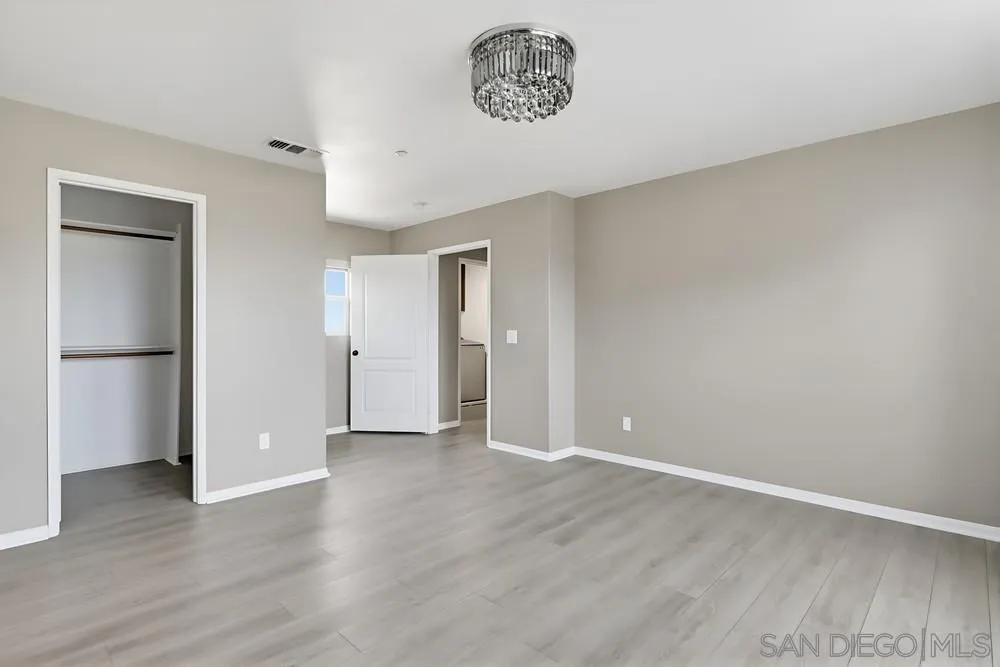 2170 Bobcat Court, Unit 126 Chula Vista, CA 91915 - Photo 15 of 28 a view of an empty room and wooden floor