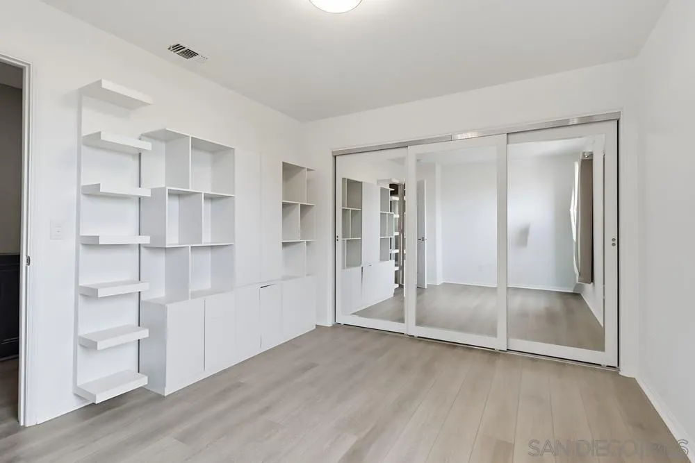 2170 Bobcat Court, Unit 126 Chula Vista, CA 91915 - Photo 21 of 28 a view of empty room with wooden floor and entryway