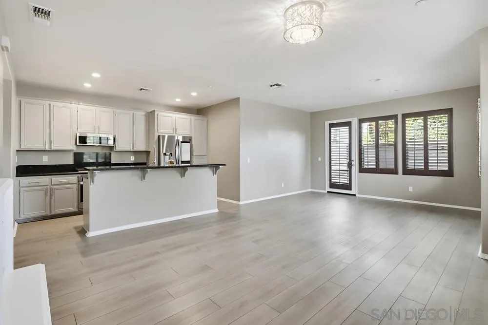 2170 Bobcat Court, Unit 126 Chula Vista, CA 91915 - Photo 4 of 28 a view of kitchen with granite countertop stainless steel appliances refrigerator sink and cabinets