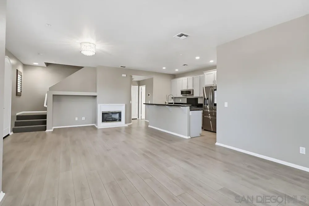 2170 Bobcat Court, Unit 126 Chula Vista, CA 91915 - Photo 5 of 28 a view of a kitchen with a sink and a stove top oven